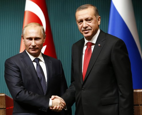 Russia's President Putin shakes hands with Turkey's President Erdogan after a news conference at the Presidential Palace in Ankara