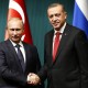 Russia's President Putin shakes hands with Turkey's President Erdogan after a news conference at the Presidential Palace in Ankara